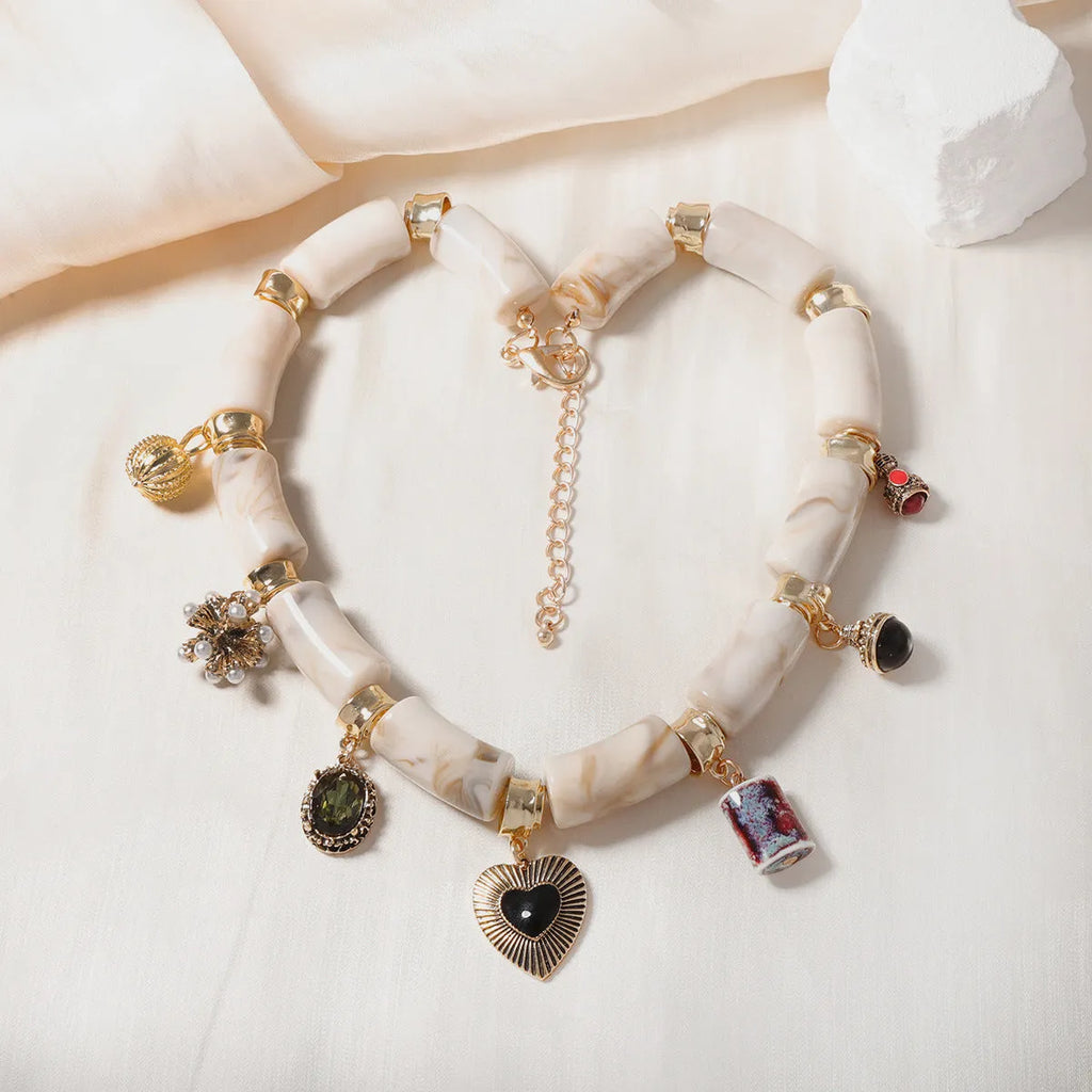 Women's bamboo design resin heart necklace with electroplated finish on adjustable chain