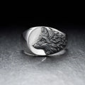 Men's silver geometric wolf head ring in retro domineering style on a grey background.