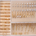 108-piece gold and yellow geometric pearl earring set with round decorative elements