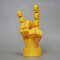 Yellow articulated hand props with movable joints measuring 5x5.38x7.5cm