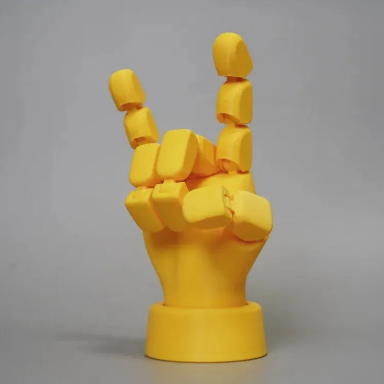 Yellow articulated hand props with movable joints measuring 5x5.38x7.5cm