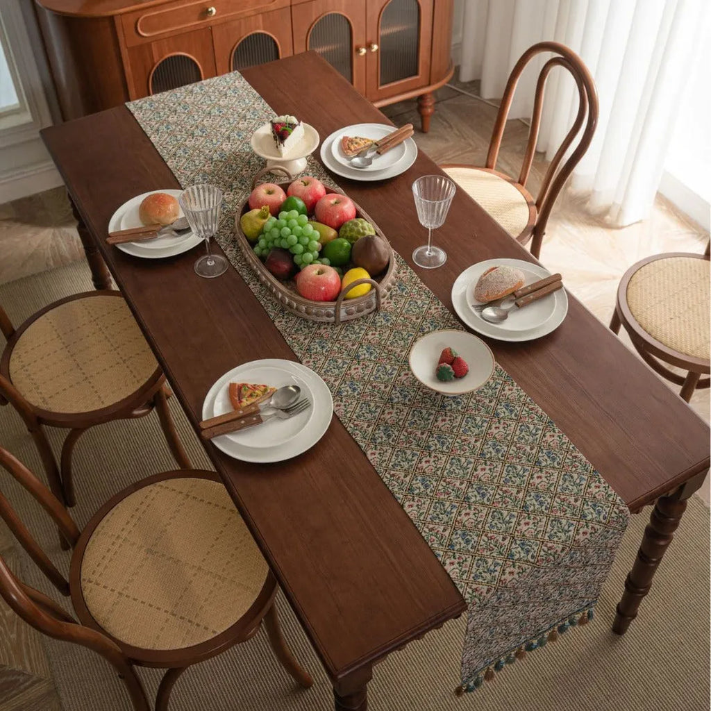 Rhyme Nordic Jacquard table runner with bouquet stripe pattern and tassel trim on dining table