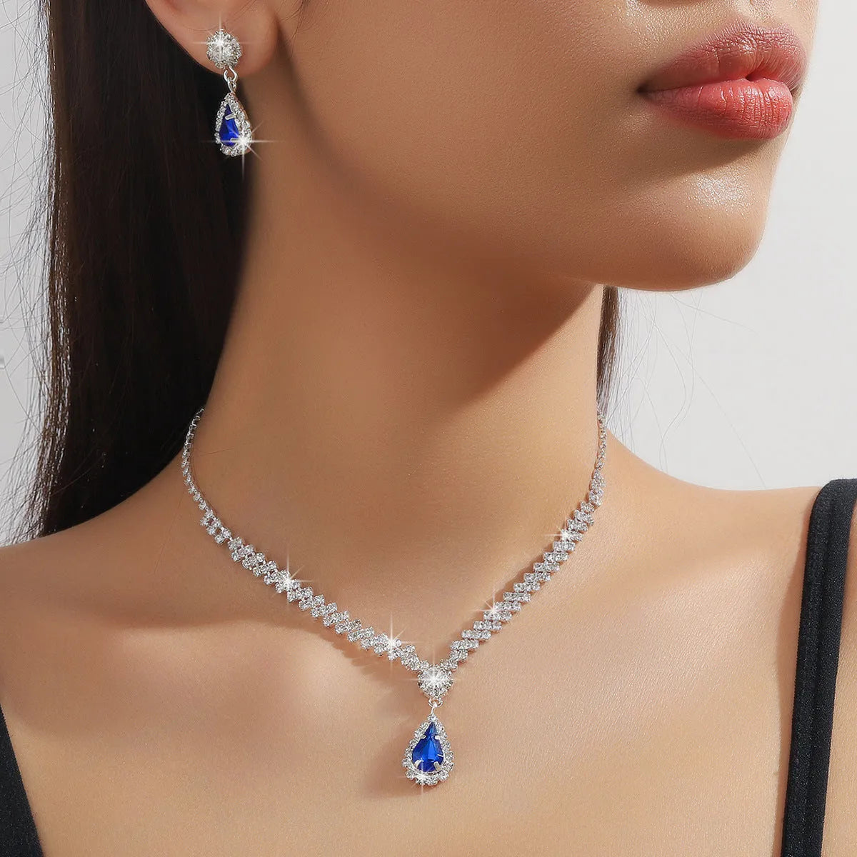 Claw chain necklace and earrings set with rhinestone water drops in multiple colour options