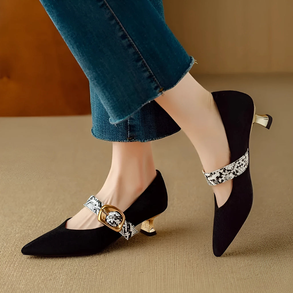 Women's black pointed toe stiletto heels with a buckle fastening on the side