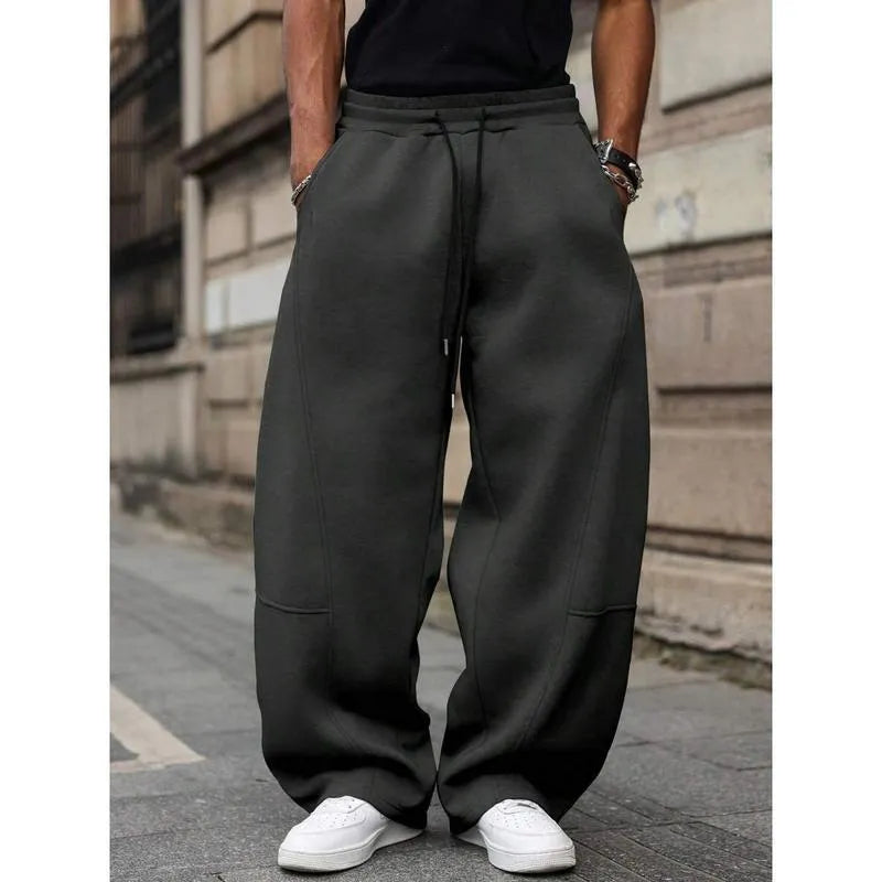 Men's straight-leg high-waist trousers in a cropped length, shown in a dark grey colour.