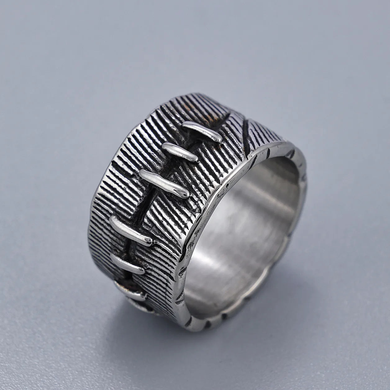 Dark punk-style geometric titanium steel double ring in retro colour on a U-shaped band.