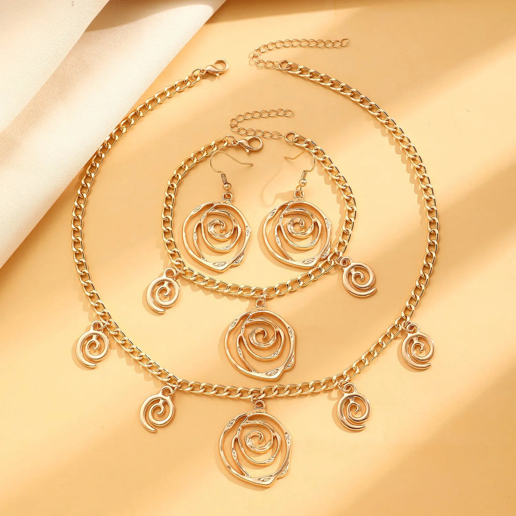 Spiral donut design women's jewellery set showing matching necklace, bracelet, and ear hooks in gold electroplated finish