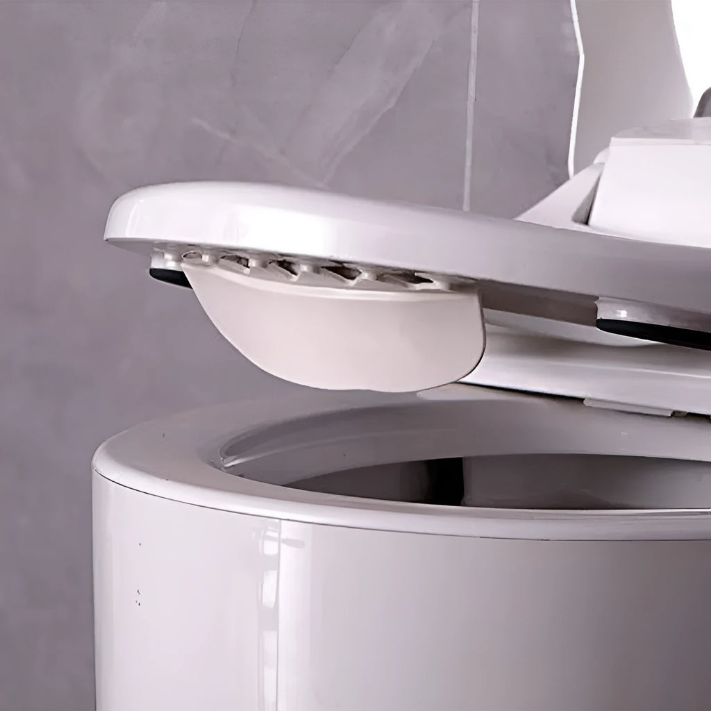 White PVC urine blocking splash guard for toilet training, shown on a toilet seat.