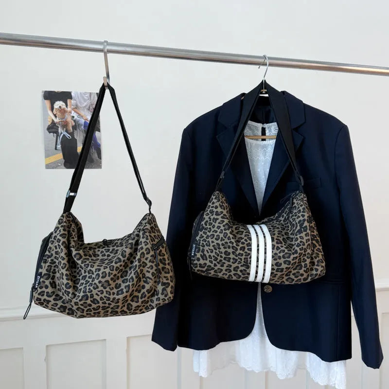 Leopard print cross-body messenger bag with shoulder strap and stitching details