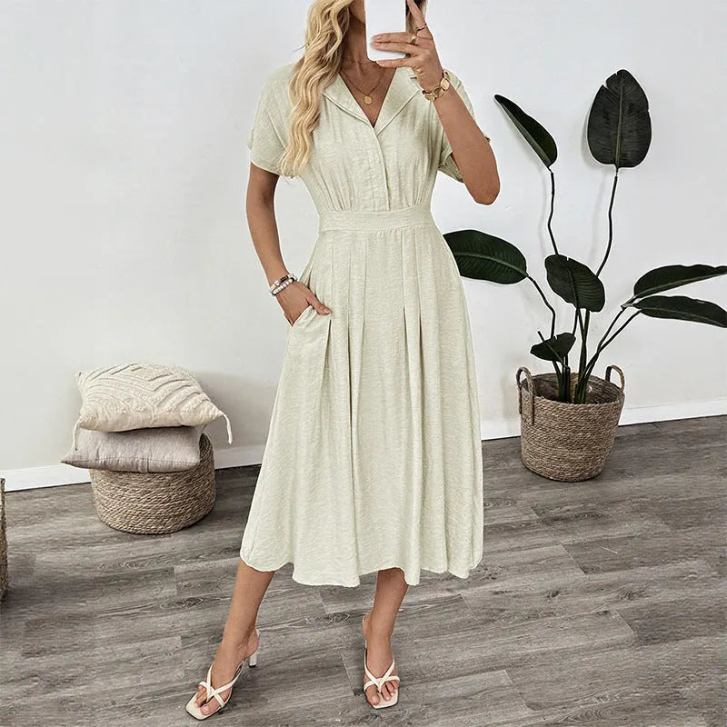 Light green twill lapel shirt dress with waist tie and splicing detail on a mannequin