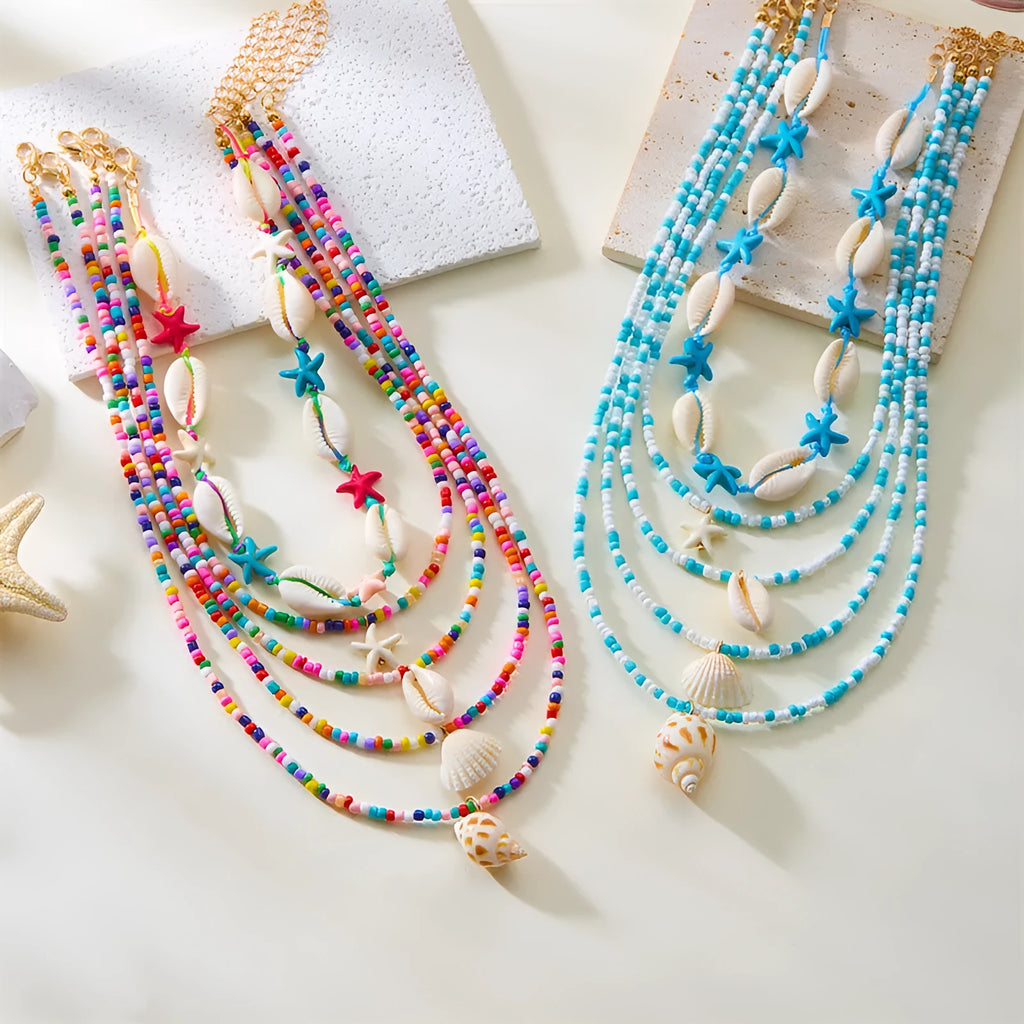 Five women's necklaces with shell and conch bead pendants on adjustable electroplated alloy chains