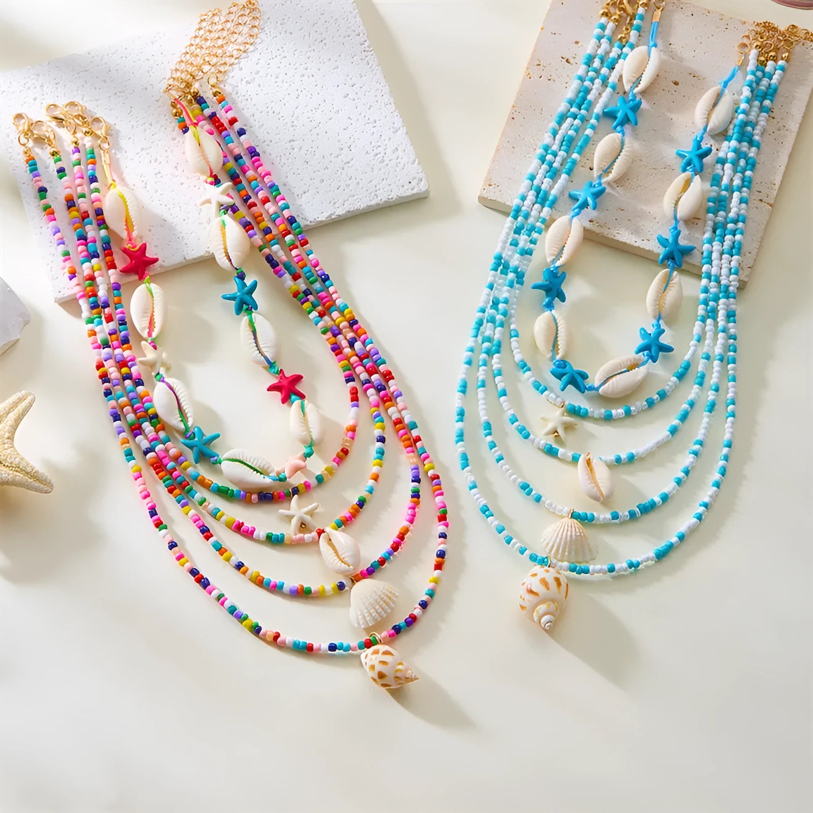 Five women's necklaces with shell and conch bead pendants on adjustable electroplated alloy chains