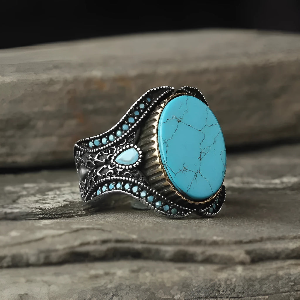 Men's round turquoise alloy ring in antique silver finish on size chart showing UK sizes 6 to 13