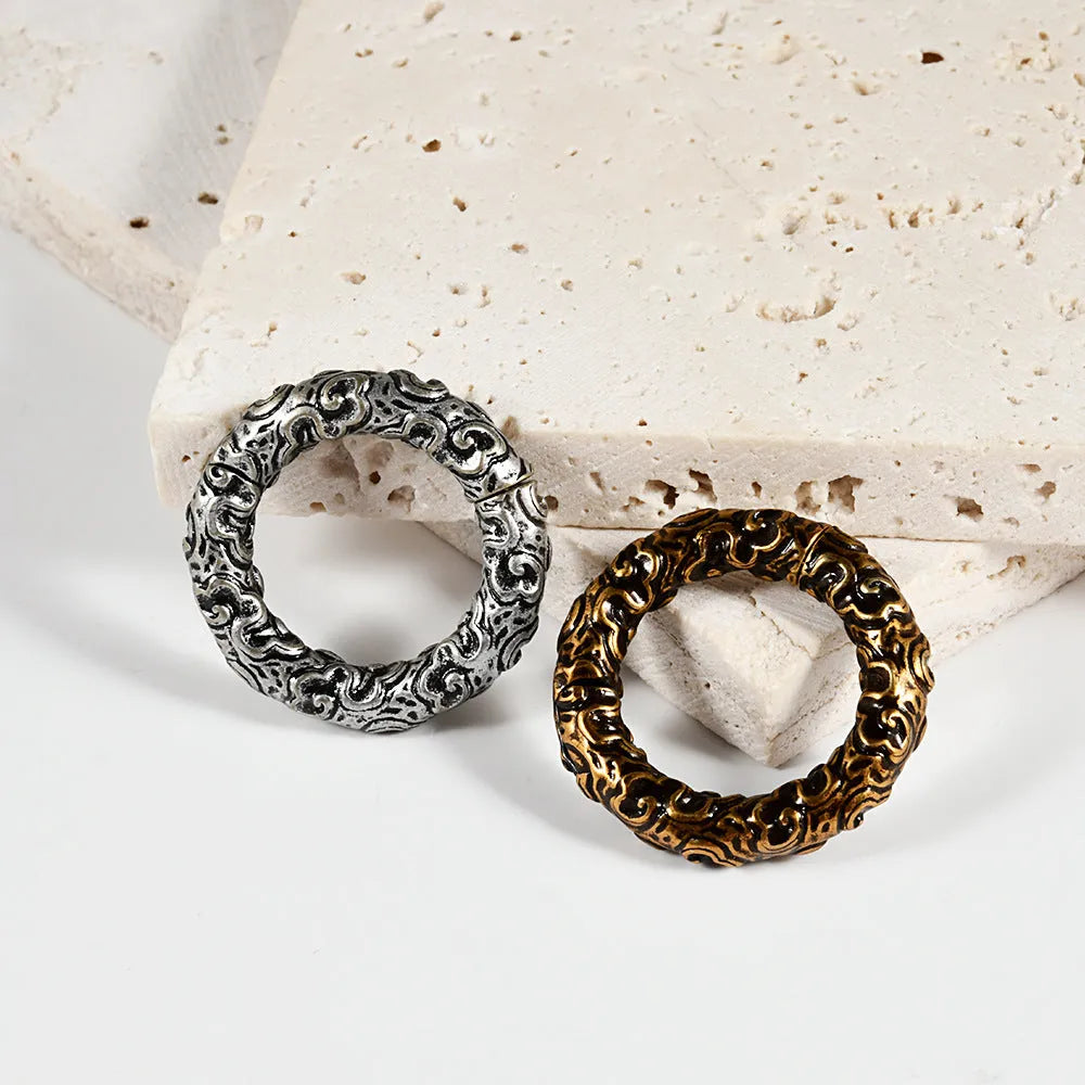 Stainless steel fashion earrings with totem pattern design in electroplated finish showing colour variation options