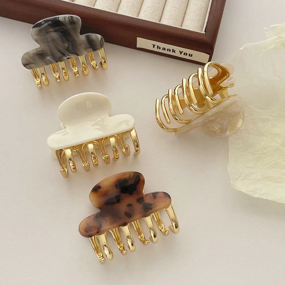 Women's retro acetate hair barrettes with metal grip in medium size showing four R08 colour options
