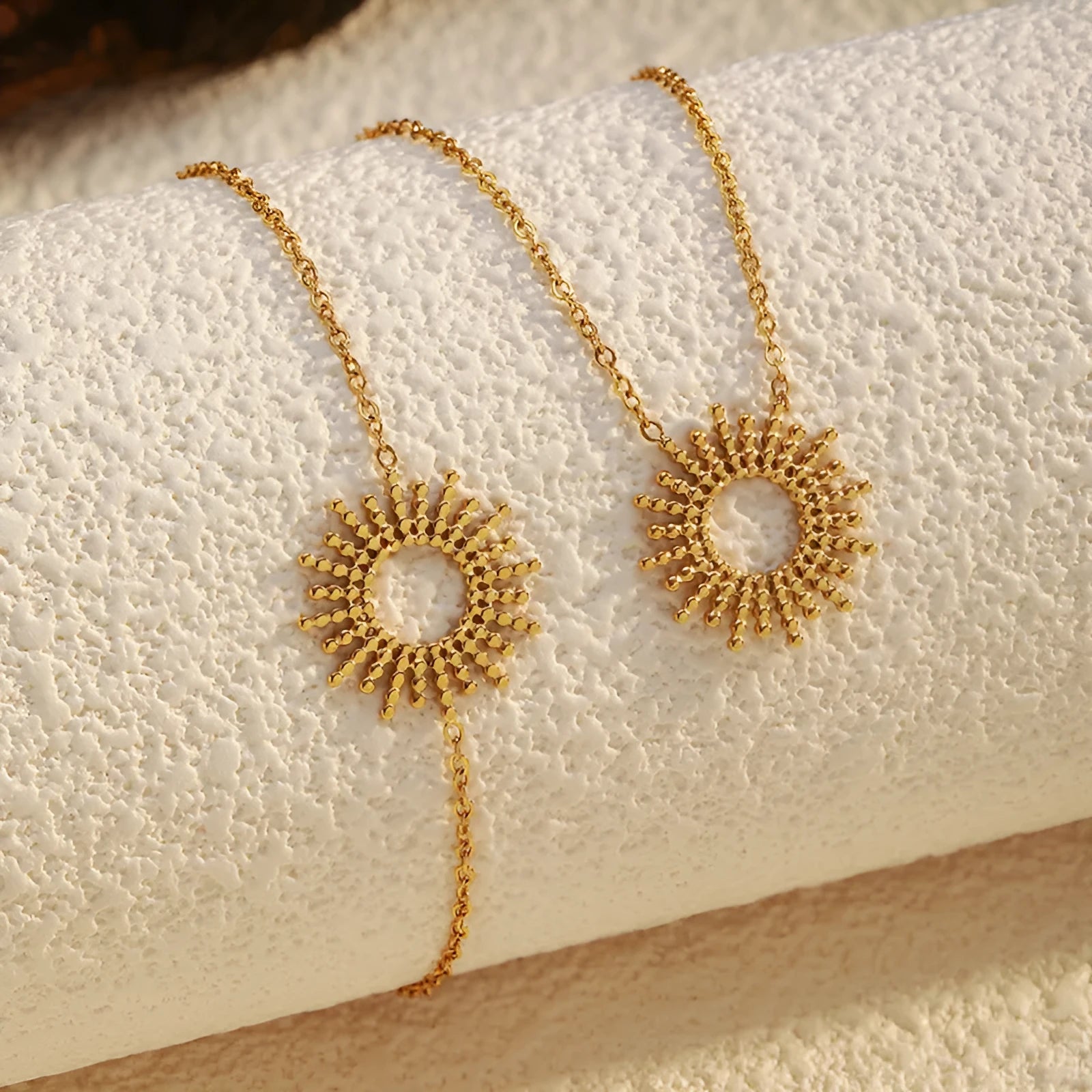 Gold geometric necklace and bracelet set with stainless steel construction and chain designs