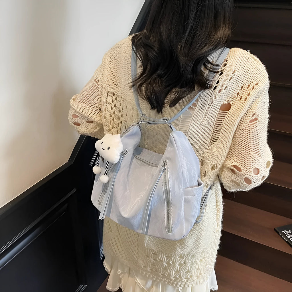Women's soft PU fashion backpack in multiple colours with decorative pendant accessory