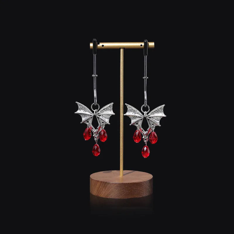 Silver bat nipple clamp with ruby design and adjustable pressure mechanism