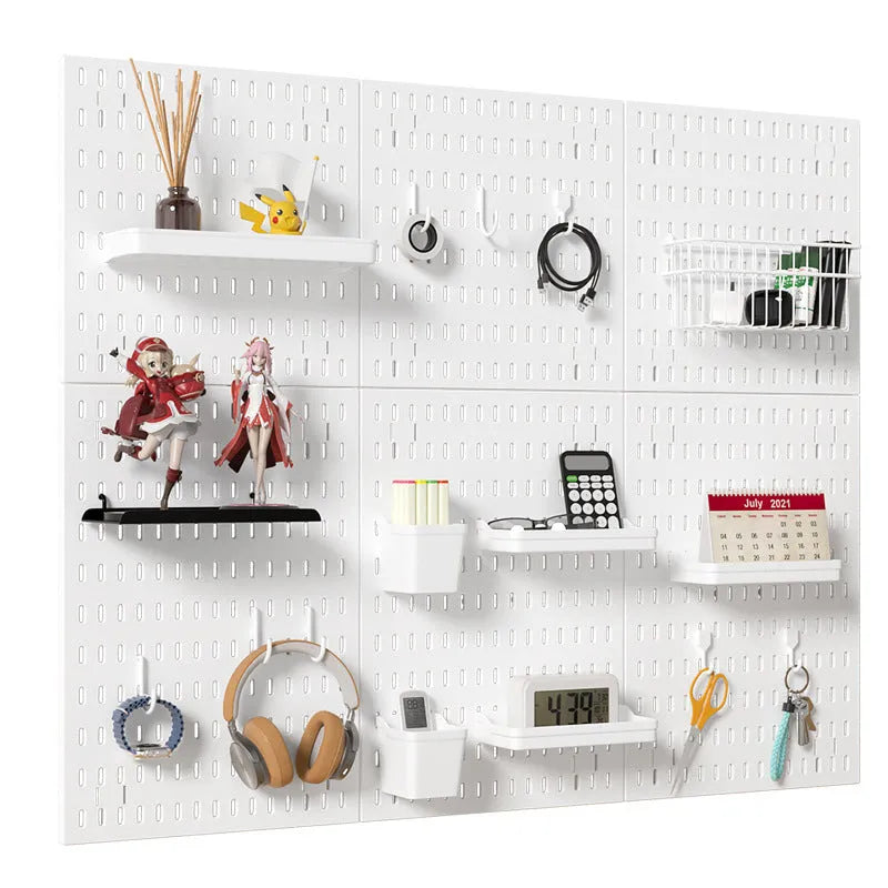 White punch-free wall wire-wrap storage board with organisational items displayed