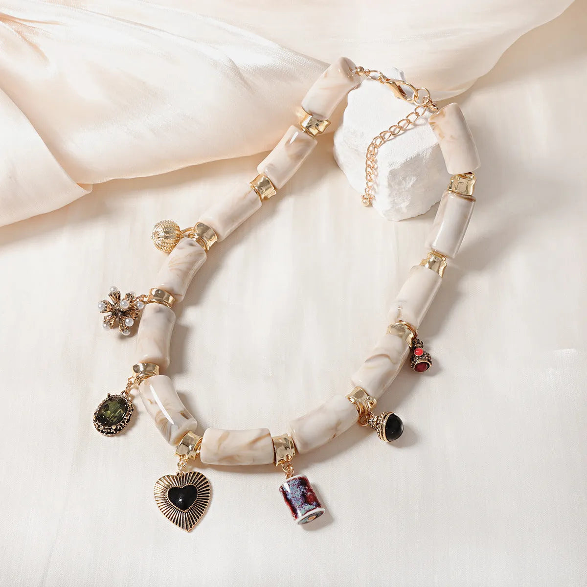 Women's bamboo design resin heart necklace with electroplated finish on adjustable chain