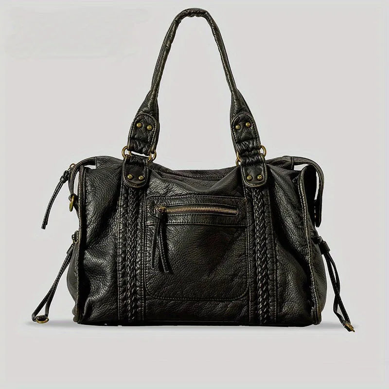 Women's retro motorcycle style messenger bag in bright black with golden edge, showing internal zipper compartments and single shoulder strap