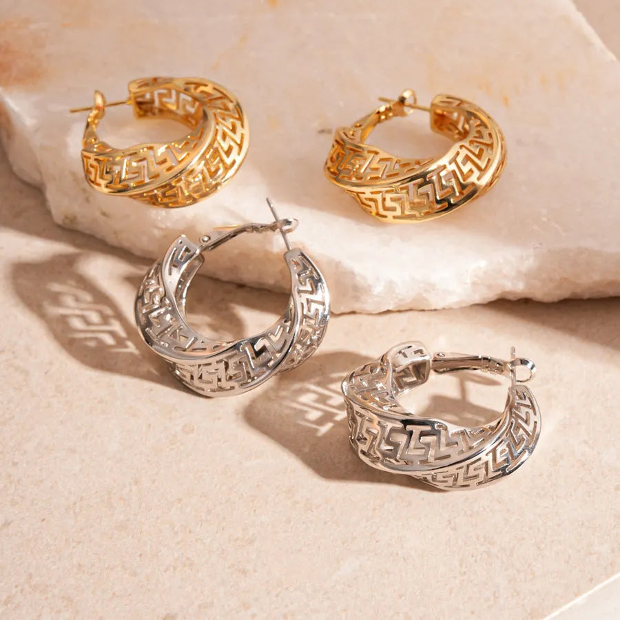 Geometric hollow stud earrings with twisted round design in gold or silver electroplated finish