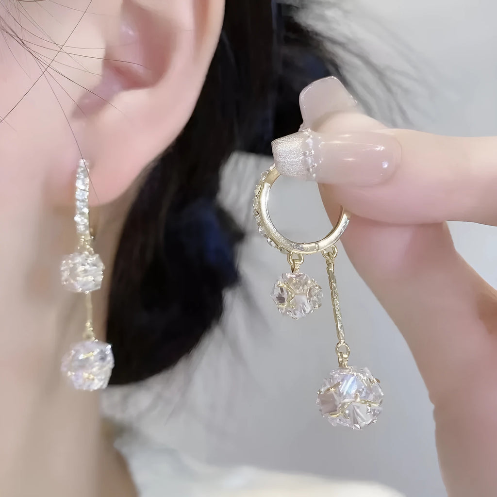 Women's silver tone drop earrings with tassel ball and rhinestone ball double pendant design