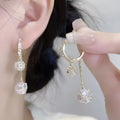 Women's silver tone drop earrings with tassel ball and rhinestone ball double pendant design