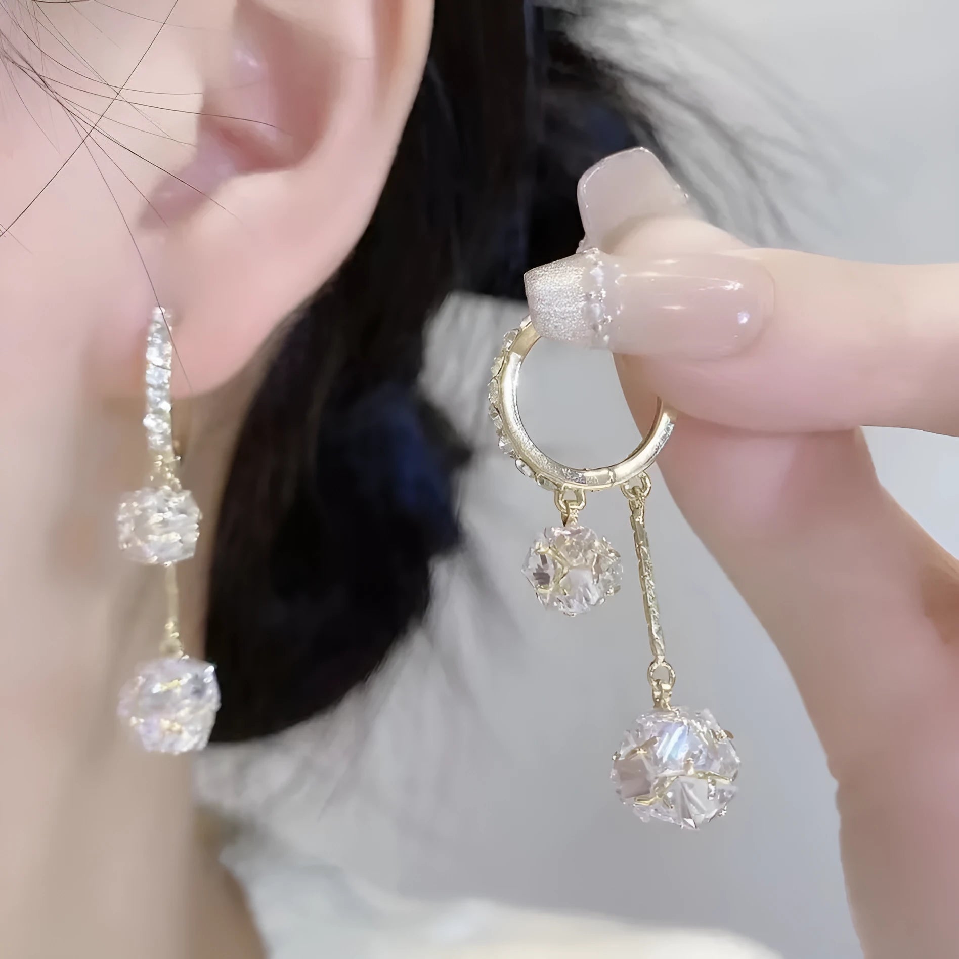 Women's silver tone drop earrings with tassel ball and rhinestone ball double pendant design