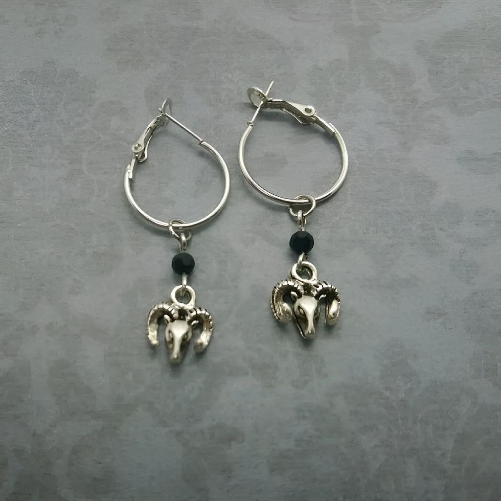 Silver-colour alloy earrings with a round ring Tibetan antelope design for women.