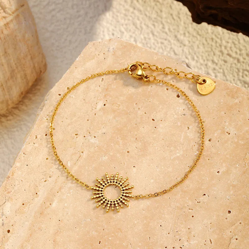 Gold geometric necklace and bracelet set with stainless steel construction and chain designs