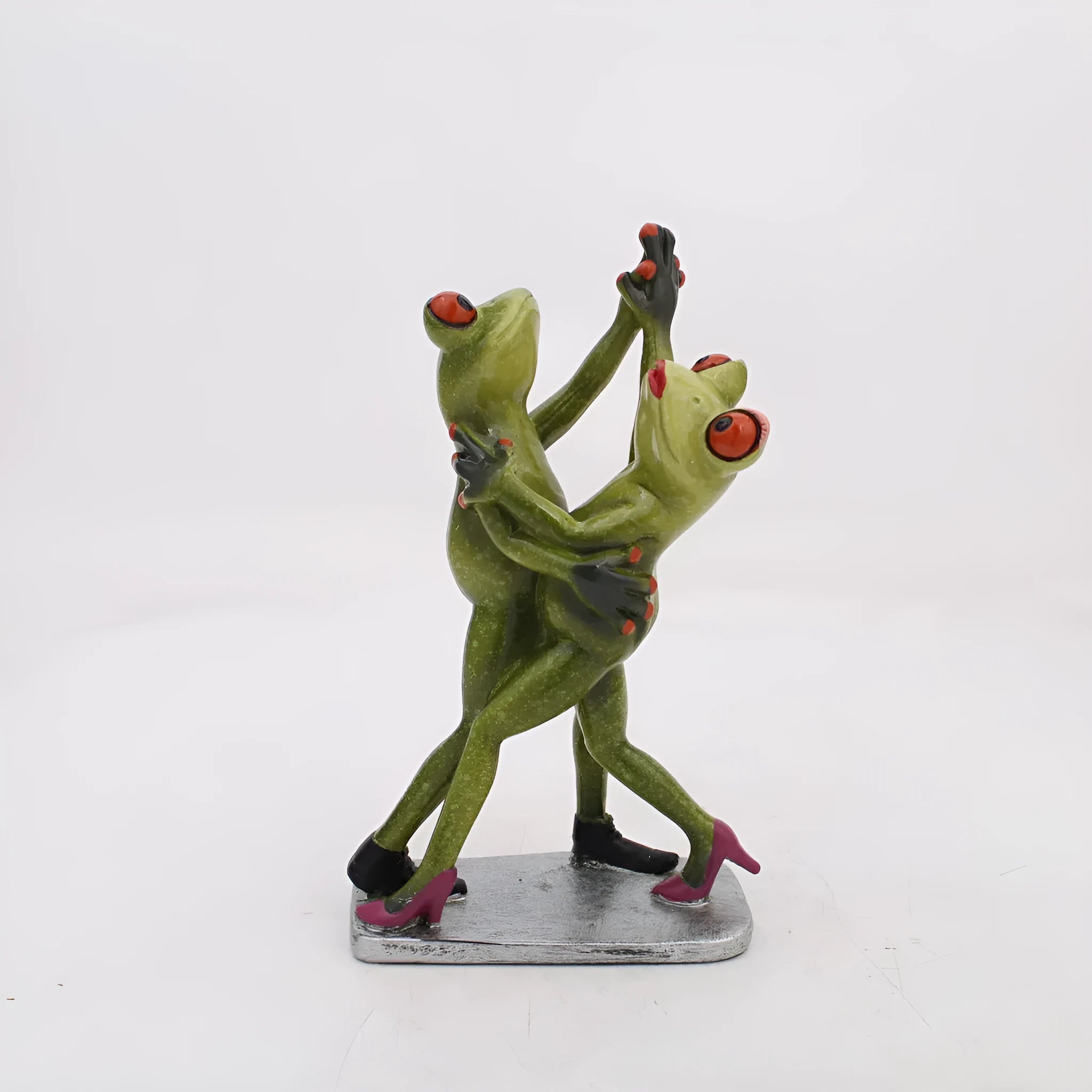 Pastoral style green resin frog decoration figurine on a wooden shelf.