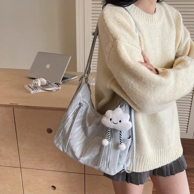 Women's soft PU fashion backpack in multiple colours with decorative pendant accessory