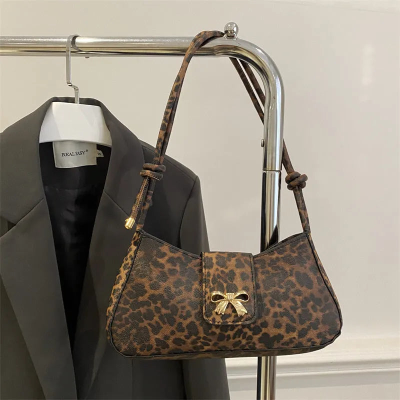 Women's casual PU leather handbag showing sandwich pocket design and available colour options