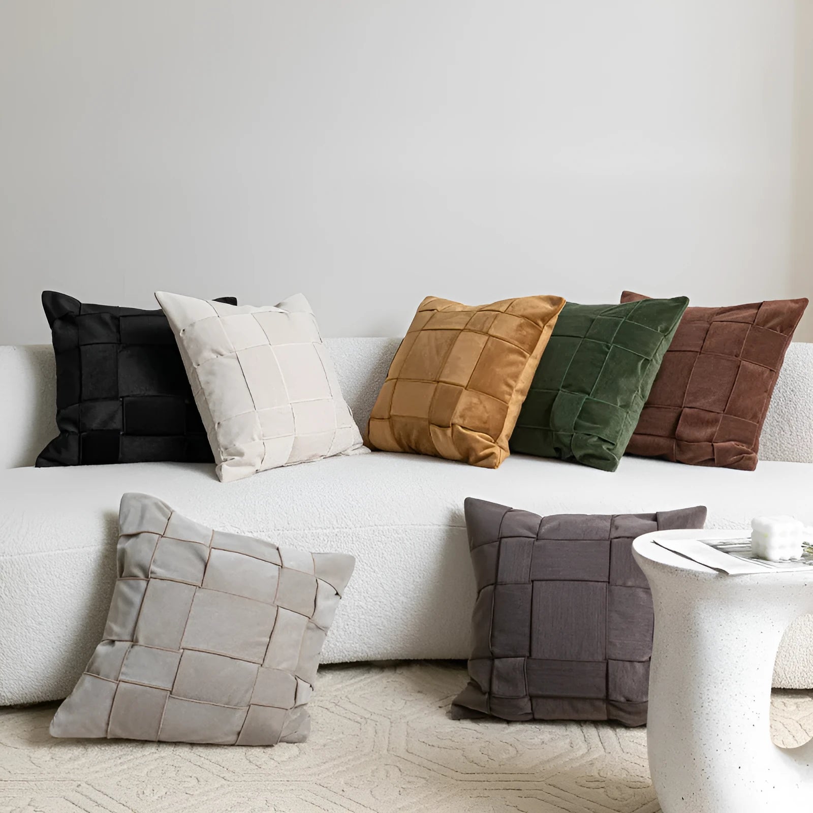 50cm square chenille woven pillow cushion in a choice of seven colours on a sofa.