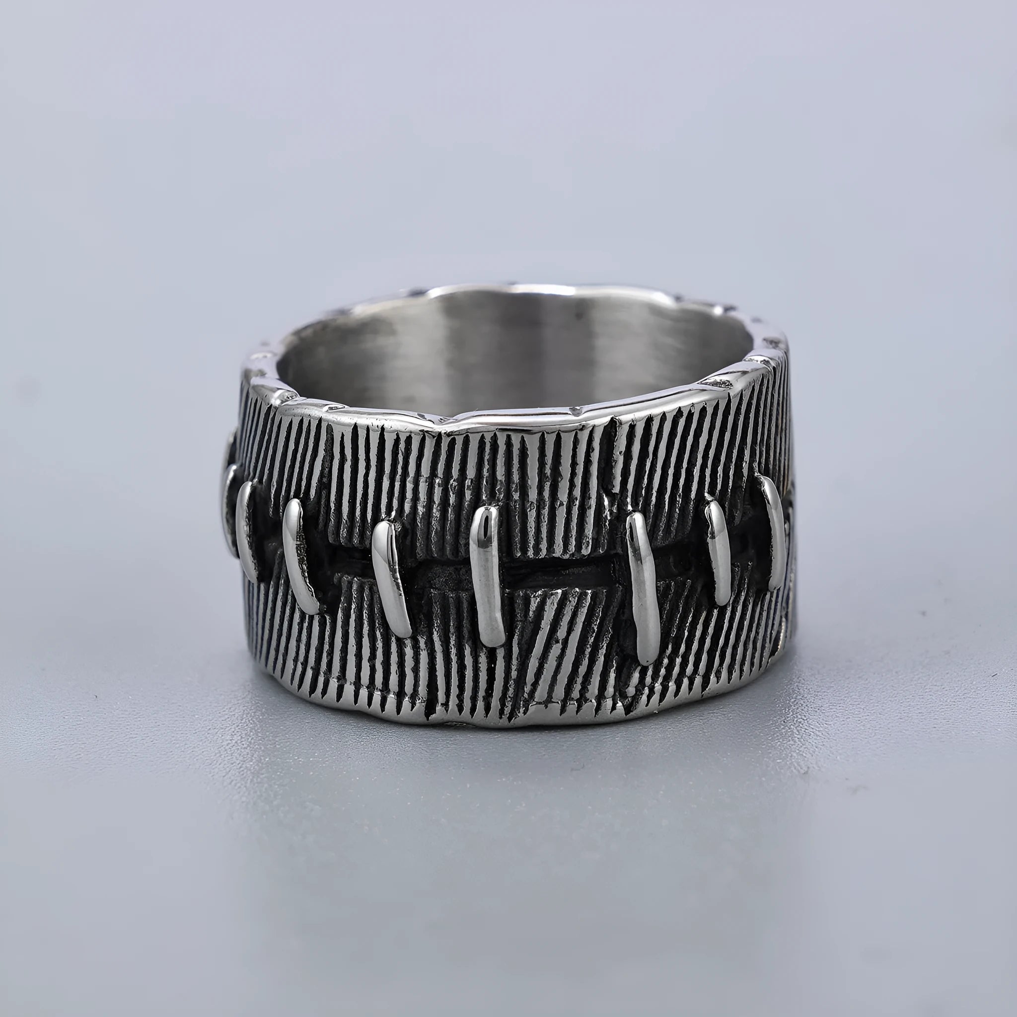 Dark punk-style geometric titanium steel double ring in retro colour on a U-shaped band.