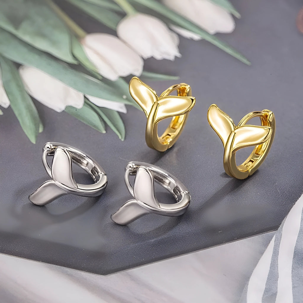 A pair of simple fishtail design earrings in a choice of white gold or yellow gold colour.