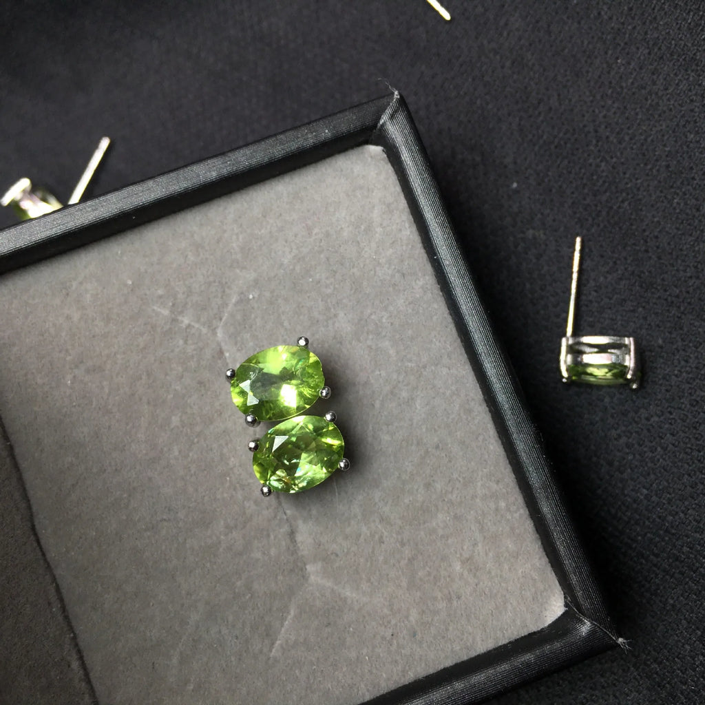 Natural grass green olivine faceted stud earrings in S925 sterling silver setting.