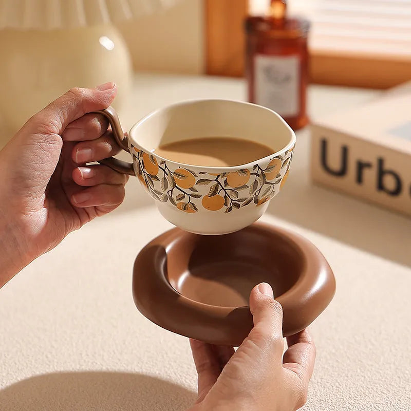 Retro ceramic coffee cup and saucer set in black or orange with medieval design