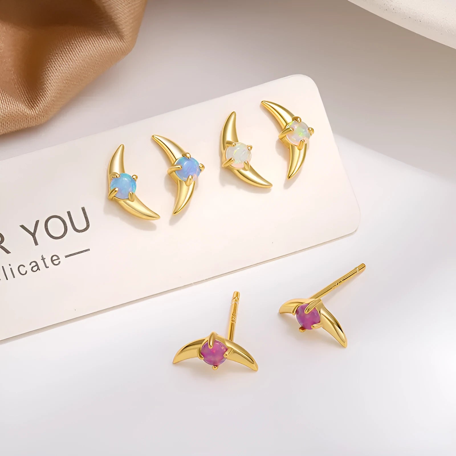 Geometric shaped 925 silver women's earrings with electroplated finish and coloured stone detail.