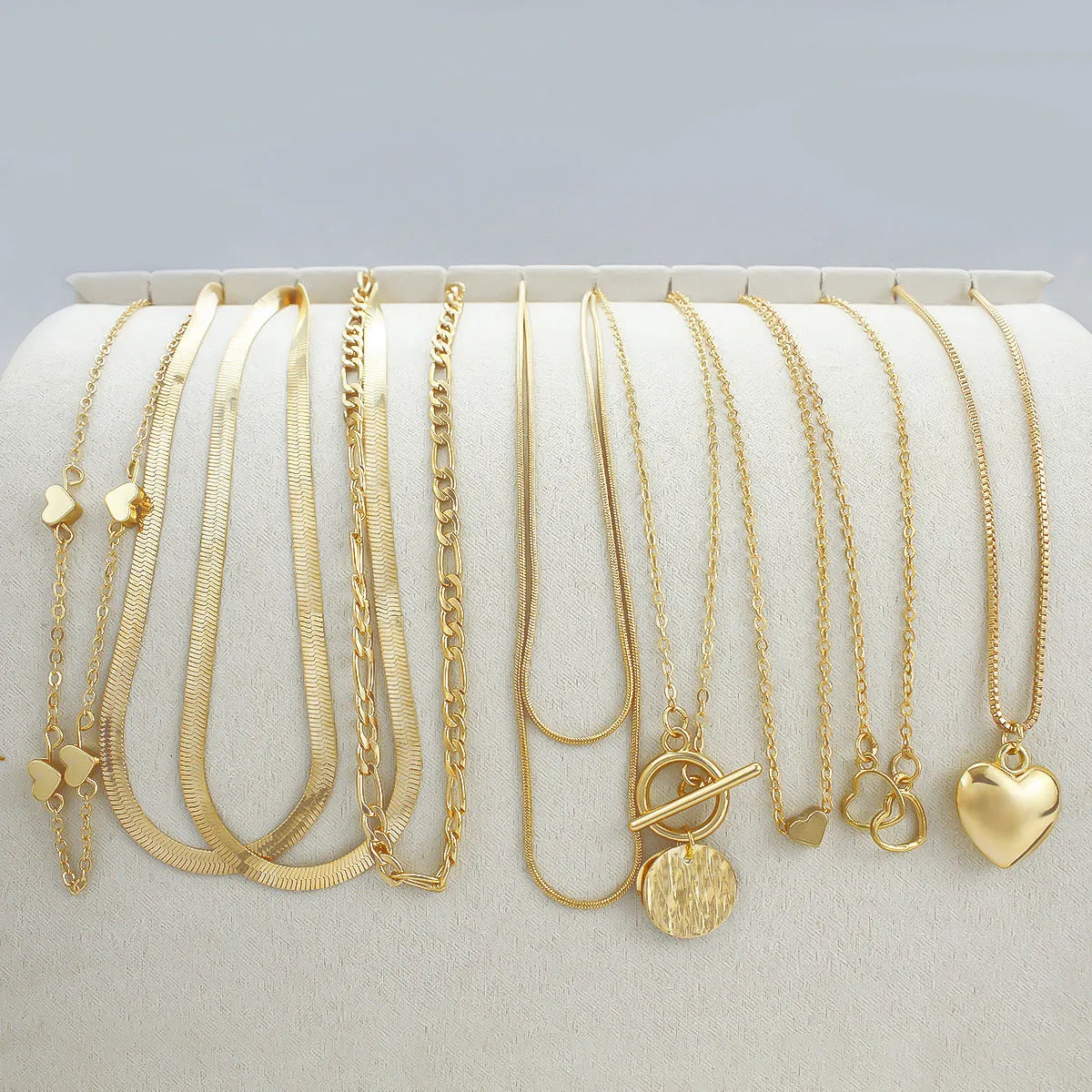 Women's gold electroplated ten-piece necklace set with snake bones chains and adjustable 21-50cm perimeter