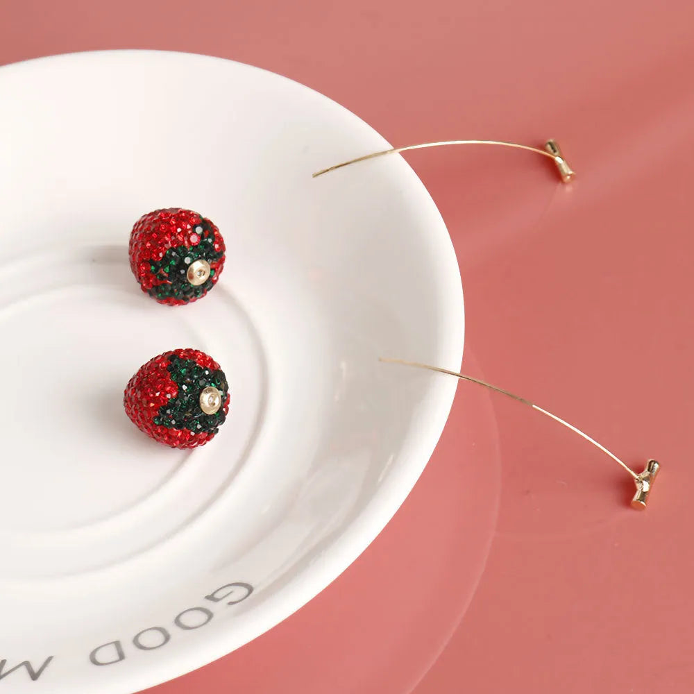 Geometric strawberry earrings with spot drill design in zinc alloy, showing colour variations