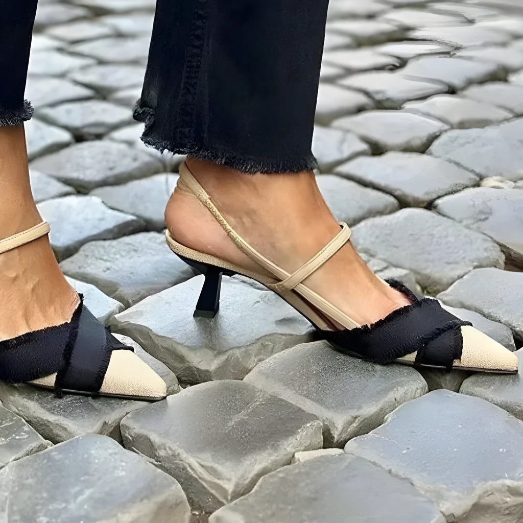 Women's apricot and black colour block stiletto sandals with pointed toe and buckle.