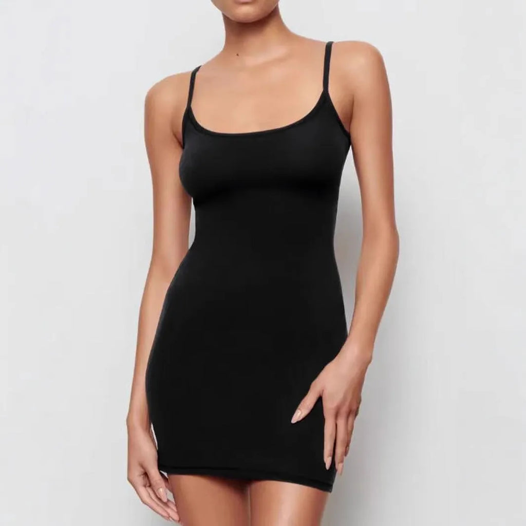 Black sleeveless sling dress with a sheath silhouette and short skirt.