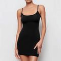 Black sleeveless sling dress with a sheath silhouette and short skirt.