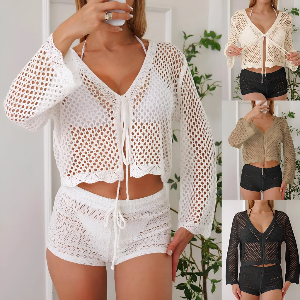Women's apricot hollow knit cardigan blouse with bell sleeves laid flat.