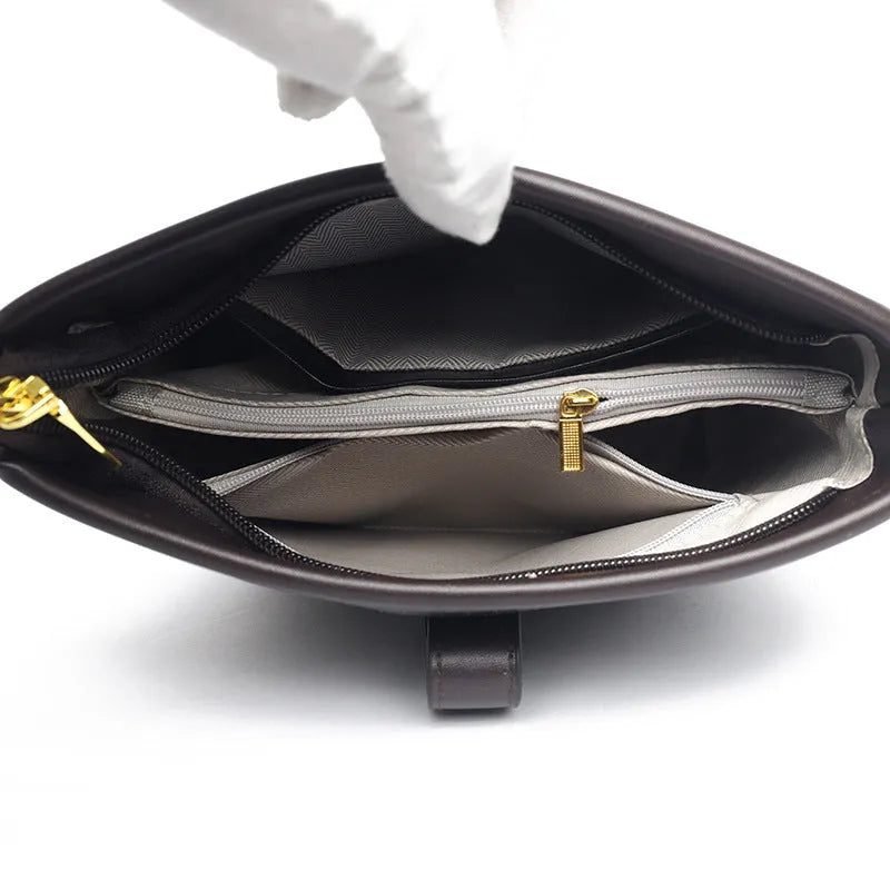 Korean style soft PU bucket messenger bag with double shoulder straps in black colour showing sandwich pocket and sewing thread details