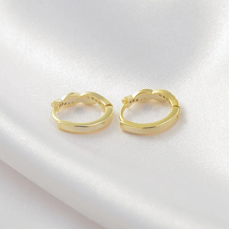 Geometric interwoven hemp rope earclip earrings in gold and silver colours with diamond-cut copper finish