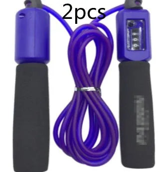 Adjustable skipping rope with blue foam handles and heavy-duty PVC cable on a grey background