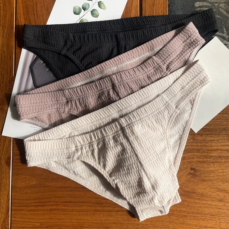 Men's solid colour cotton triangle underwear briefs showing mid waist design and available colour options